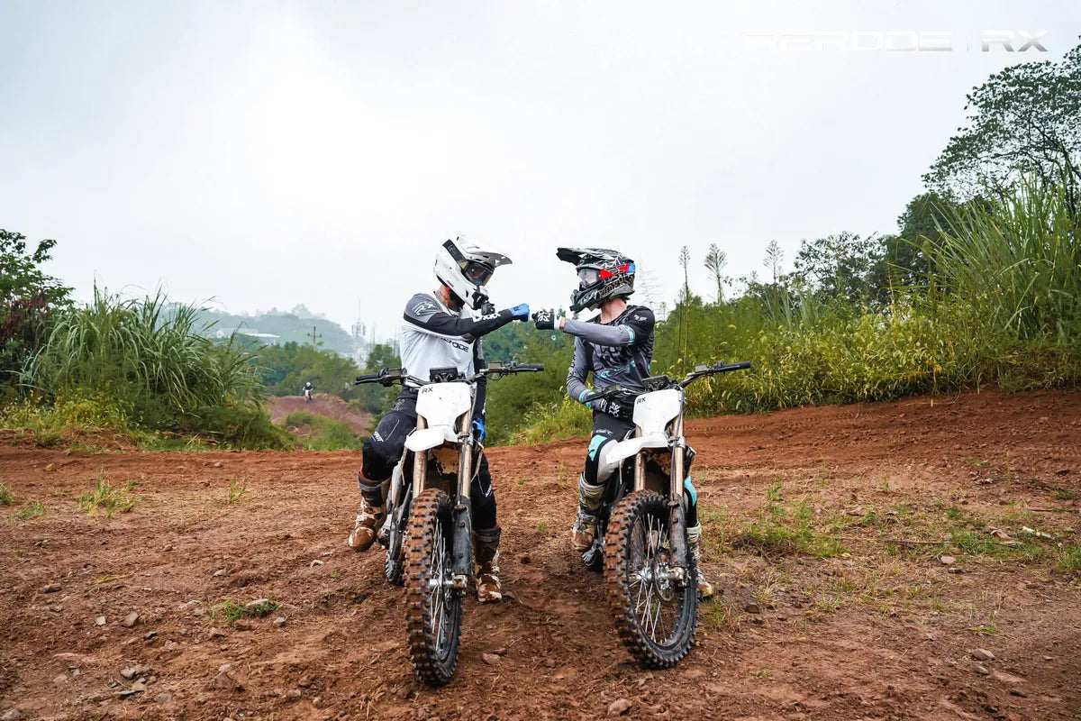 Two riders on Rerode RX bikes on a dirt track